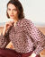 Bedrukte bloes, details van striklintjes (beige / bordeaux)