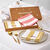 Coffret de 4 serviettes de table en coton, brodées (rose + jaune)