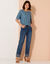 Pull festonné col rond manches coudes, maille ajourée fantaisie (bleu jean)