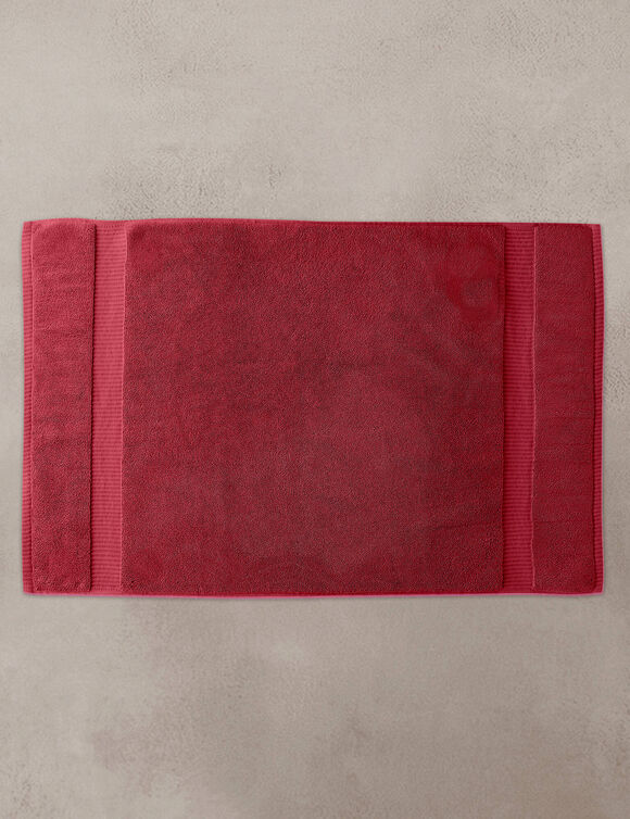 Badmatje van badstof met sierrand en premium comfort (granaatrood)