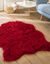 Tapijt met lange haren in de vorm van een dierenhuid (rood)