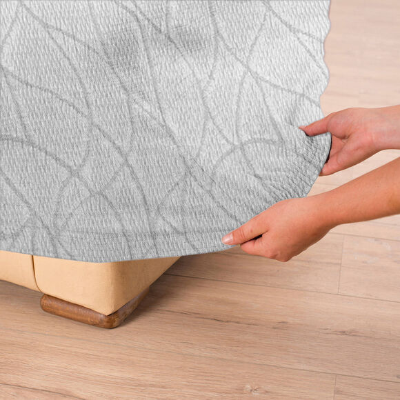 Housse extensible motif jacquard "serpentins" pour fauteuil et canapé  (gris clair)