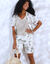Soepele, elastische short, palmboomprint (ecru / kaki)