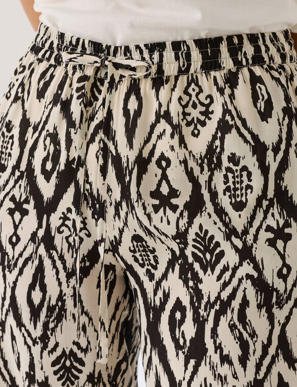 Pantalon fluide imprim&eacute; (&eacute;cru / noir)