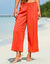 Ruime effen broek, seersuckereffect (paprika)