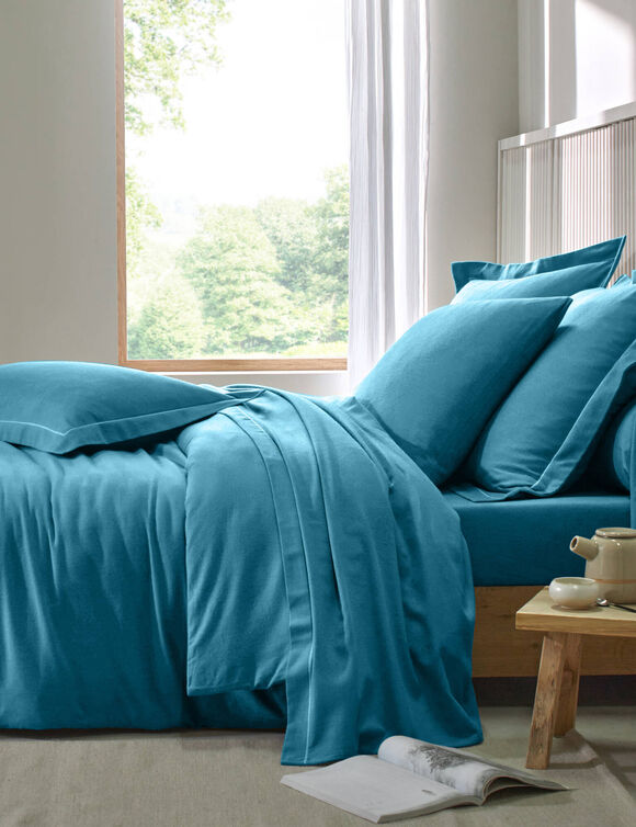 Effen hoeslaken van flanel, 130 g/m&sup2; - randbreedte 32 cm (pauwblauw)