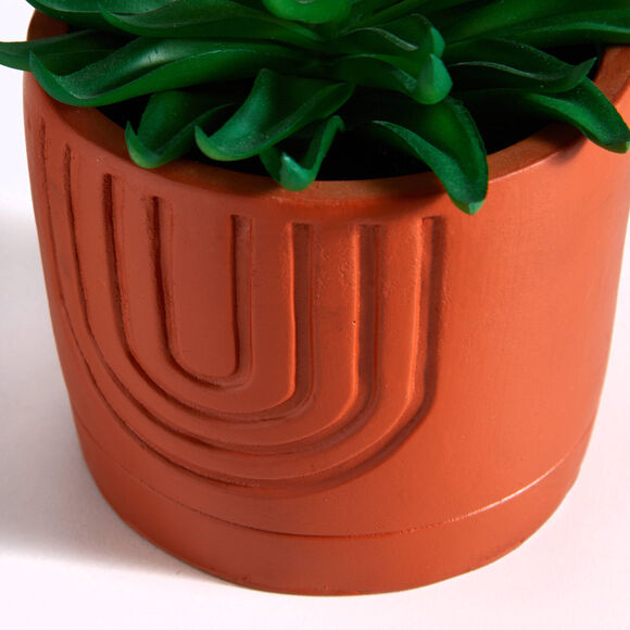 Plante verte artificielle et pot en ciment (terracotta)