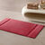 Badmatje van badstof met sierrand en premium comfort (granaatrood)