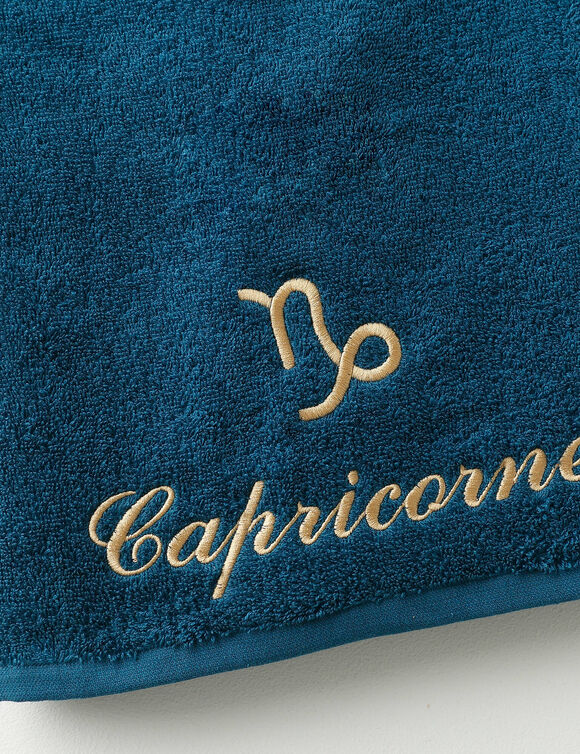 Serviettes de bain brodées Capricorne - 420g/m2 (pauwblauw)