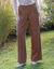 Ruime broek met plooien en hoge taille, effen (mokka)
