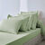 Drap-housse uni polyester - coton bonnet 32 cm (vert amande)