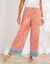 Ruime, bedrukte broek, hoge taille met smokwerk (oranje)