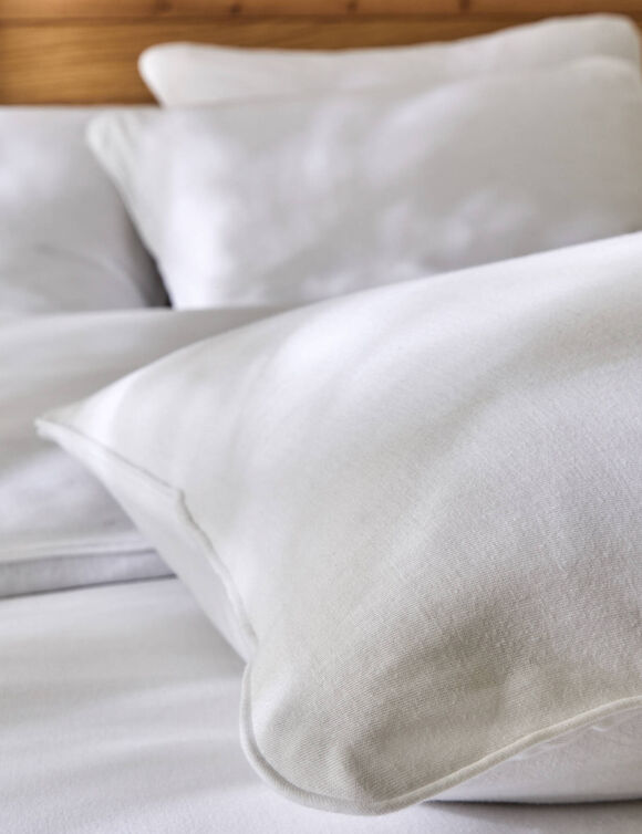 Linge de lit uni en jersey passepoilé coton (blanc)