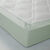 Hoeslaken in effen jersey, hoeken van 26 cm (amandel groen)